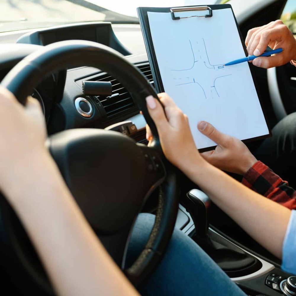 woman-and-man-with-checklist-driving-school-2-1.jpg